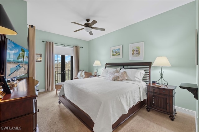 bedroom featuring ceiling fan, french doors, light colored carpet, and access to exterior