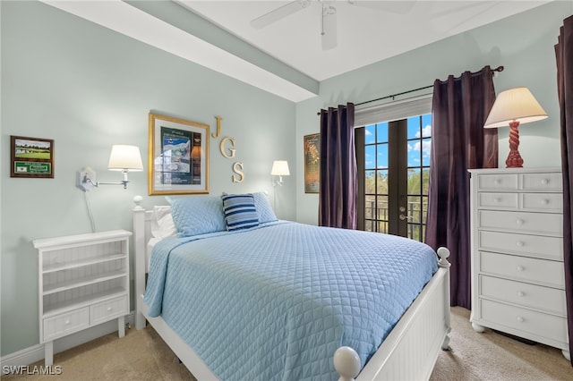 carpeted bedroom with ceiling fan, french doors, and access to outside