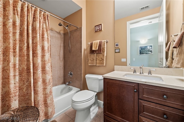 full bathroom featuring toilet, shower / bath combination with curtain, tile patterned floors, and vanity