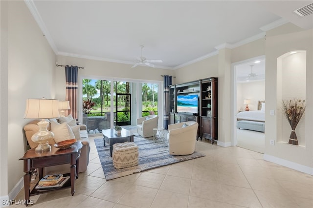 living area featuring light tile patterned floors, visible vents, ceiling fan, and ornamental molding