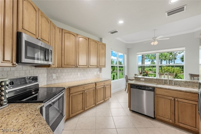 kitchen with tasteful backsplash, visible vents, appliances with stainless steel finishes, and a ceiling fan