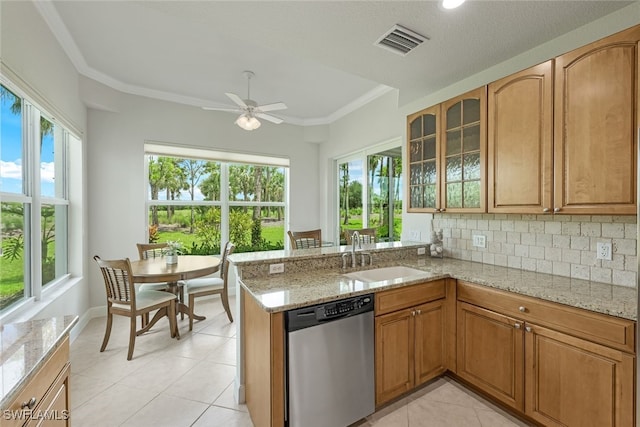 kitchen featuring visible vents, ceiling fan, a sink, dishwasher, and backsplash