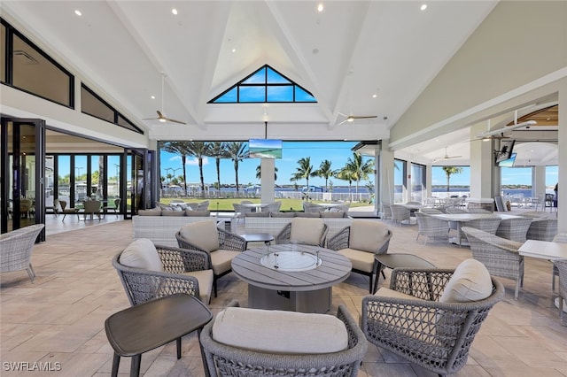 view of patio with an outdoor hangout area, outdoor dining area, and a ceiling fan