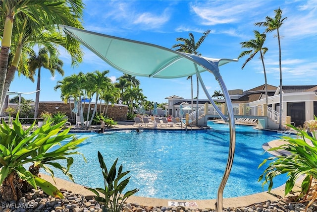 pool featuring a patio and fence