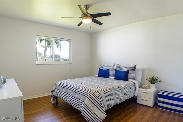 bedroom with ceiling fan and dark hardwood / wood-style flooring