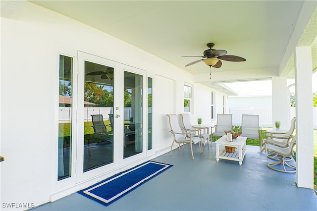 view of patio featuring ceiling fan and french doors