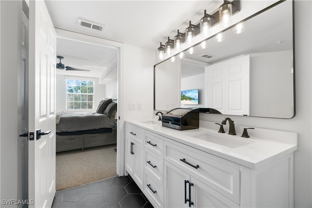 bathroom with vanity, ceiling fan, and tile patterned flooring