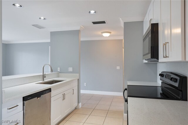 7012 Constitution Blvd Unit 206, Fort Myers, FL 33967 - kitchen with crown molding, stainless steel appliances, white cabinets, and a sink
