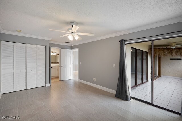 7012 Constitution Blvd Unit 206, Fort Myers, FL 33967 - unfurnished bedroom featuring crown molding, a ceiling fan, and a textured ceiling