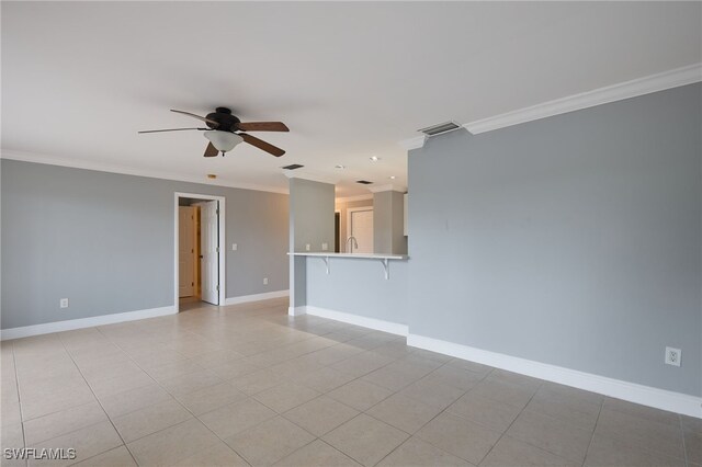 7012 Constitution Blvd Unit 206, Fort Myers, FL 33967 - empty room with ceiling fan, baseboards, light tile patterned floors, visible vents, and ornamental molding