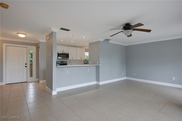 7012 Constitution Blvd Unit 206, Fort Myers, FL 33967 - unfurnished living room featuring crown molding, ceiling fan, visible vents, and plenty of natural light