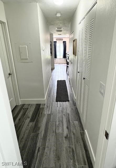 hall with dark hardwood / wood-style flooring