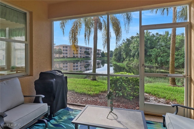 sunroom with a water view