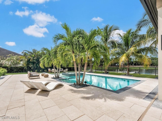 view of swimming pool with a patio