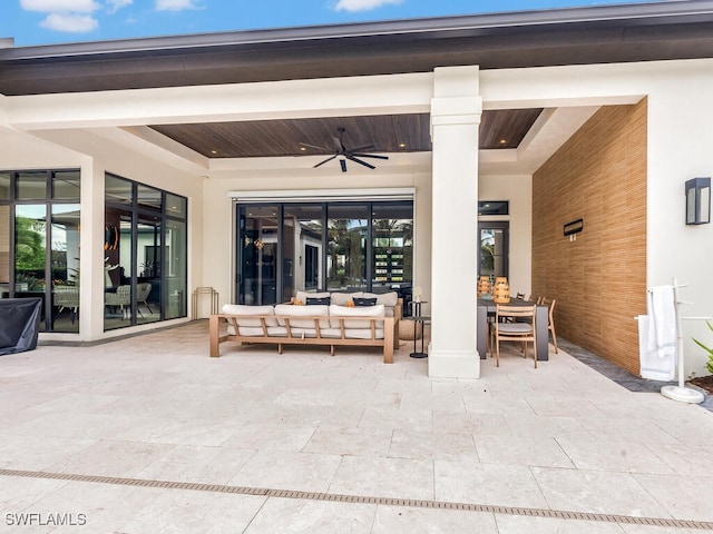 view of patio featuring ceiling fan and an outdoor living space