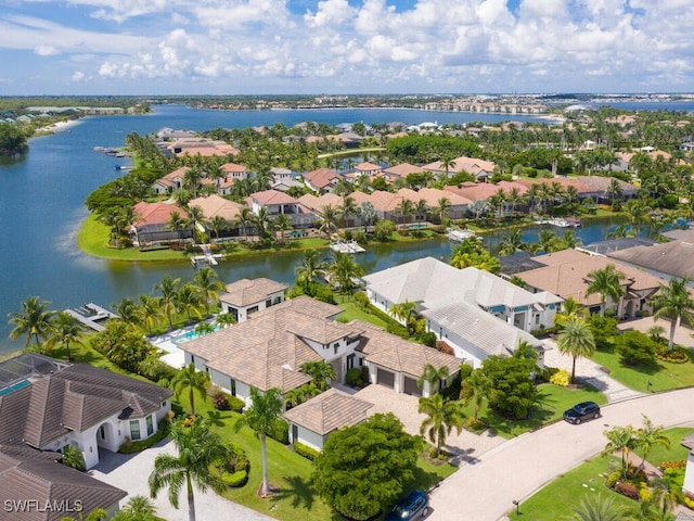 bird's eye view featuring a residential view and a water view