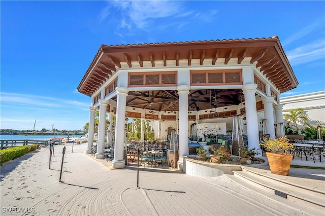 view of community with a gazebo and a water view