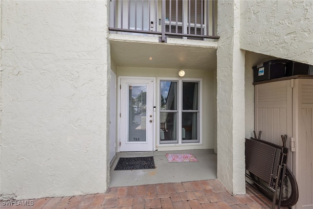 doorway to property featuring a balcony