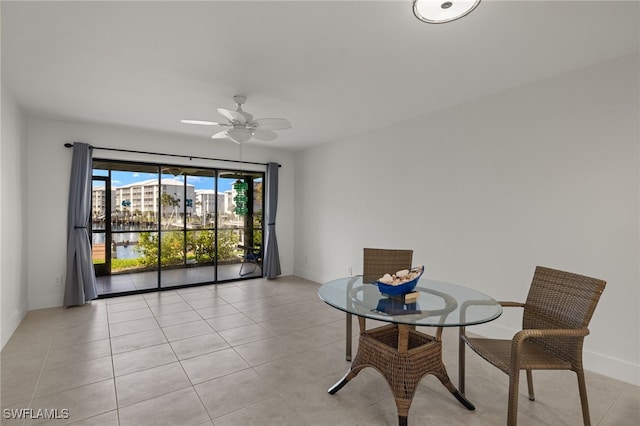 interior space featuring ceiling fan and light tile patterned flooring