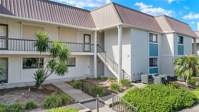 200 Lenell Rd Unit 214, Fort Myers Beach, FL 33931 - view of property with stairway and cooling unit