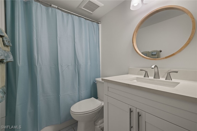 bathroom with walk in shower, toilet, and vanity