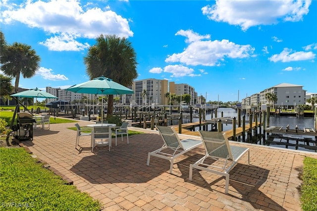 exterior space with a dock and a water view