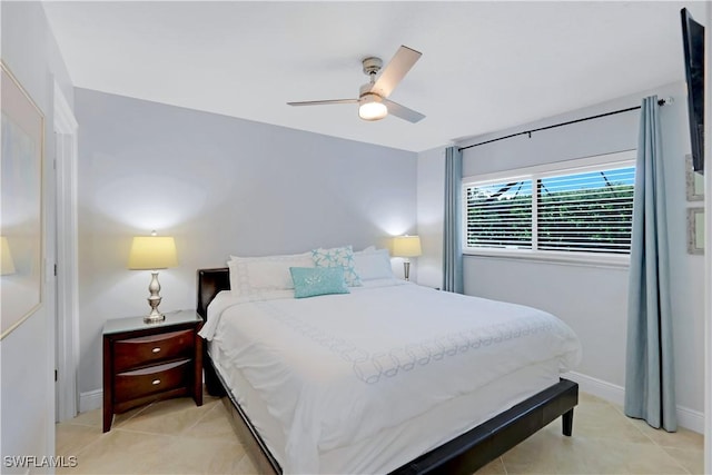 bedroom featuring light tile patterned flooring and ceiling fan