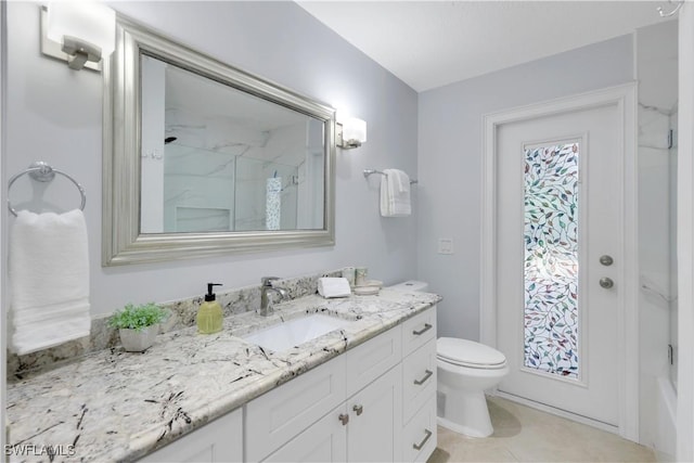 bathroom with walk in shower, vanity, toilet, and tile patterned flooring