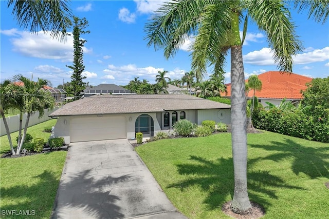 single story home featuring a garage and a front yard