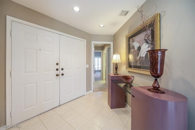 entryway featuring light tile patterned flooring