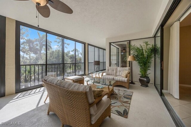 sunroom / solarium with ceiling fan