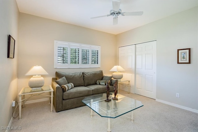 living room with carpet and ceiling fan