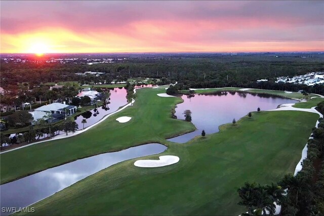 aerial view at dusk with a water view