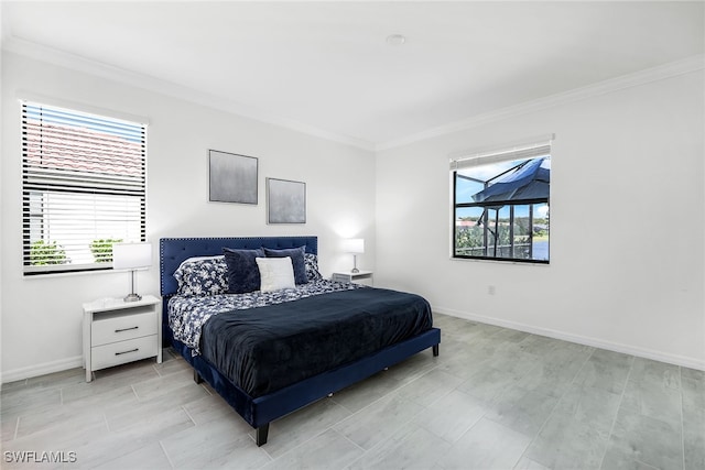 bedroom with crown molding and multiple windows