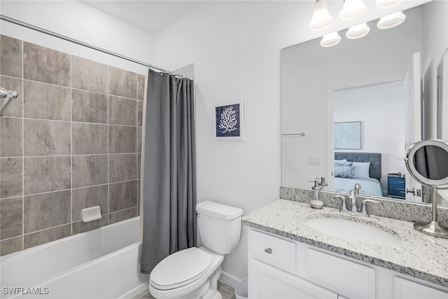 full bathroom with vanity, toilet, and shower / tub combo with curtain