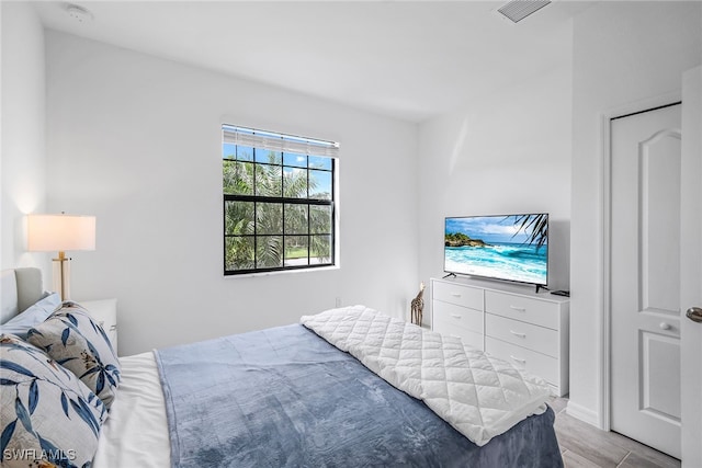 bedroom with light hardwood / wood-style flooring