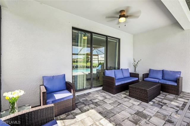 view of patio featuring an outdoor living space and ceiling fan