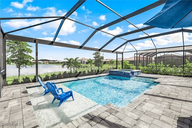 view of swimming pool with glass enclosure, a patio, an in ground hot tub, and a water view