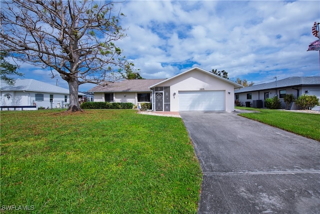 ranch-style home with a front yard and a garage