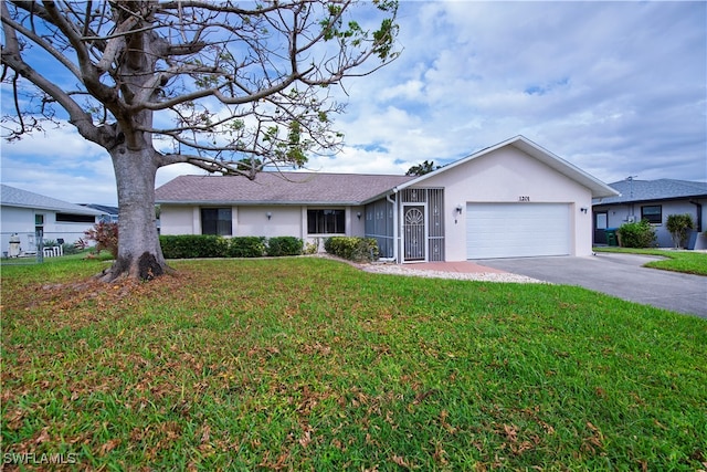 single story home with a front lawn and a garage