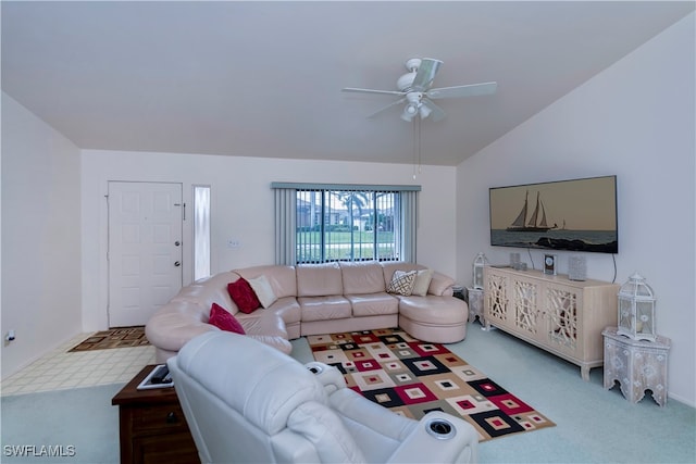 carpeted living room with lofted ceiling and ceiling fan