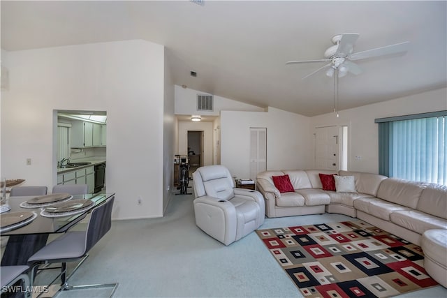 living room with lofted ceiling, sink, light carpet, and ceiling fan