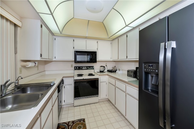 kitchen featuring white cabinets, black appliances, and sink