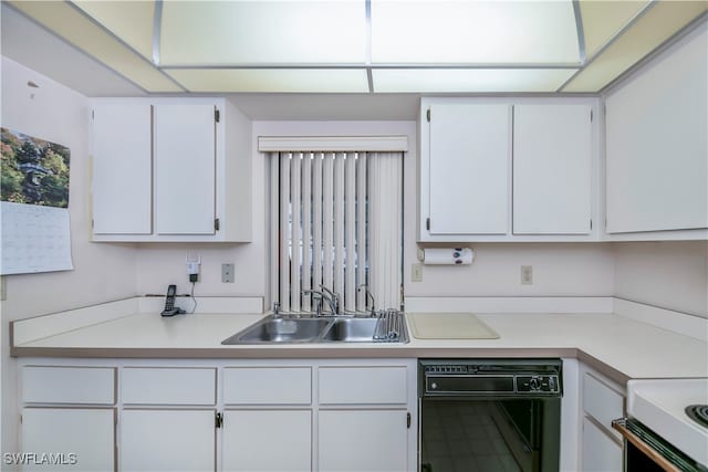 kitchen with dishwasher, sink, and white cabinets