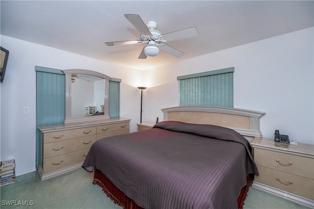 bedroom featuring light carpet and ceiling fan