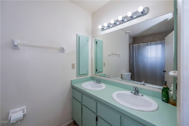 bathroom with vanity, a shower with curtain, and toilet