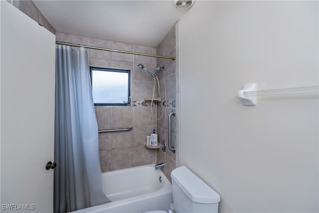 bathroom featuring toilet and shower / bath combo