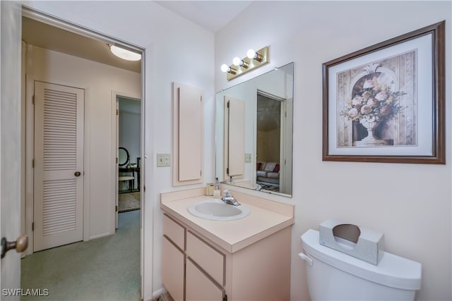 bathroom with vanity and toilet