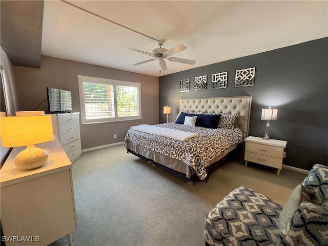 bedroom with ceiling fan and light colored carpet