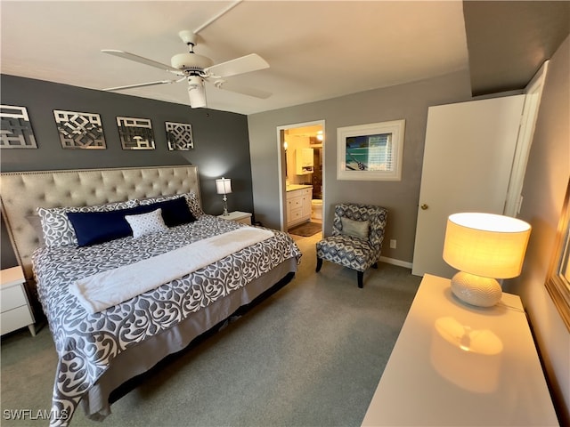 carpeted bedroom with ceiling fan and ensuite bathroom